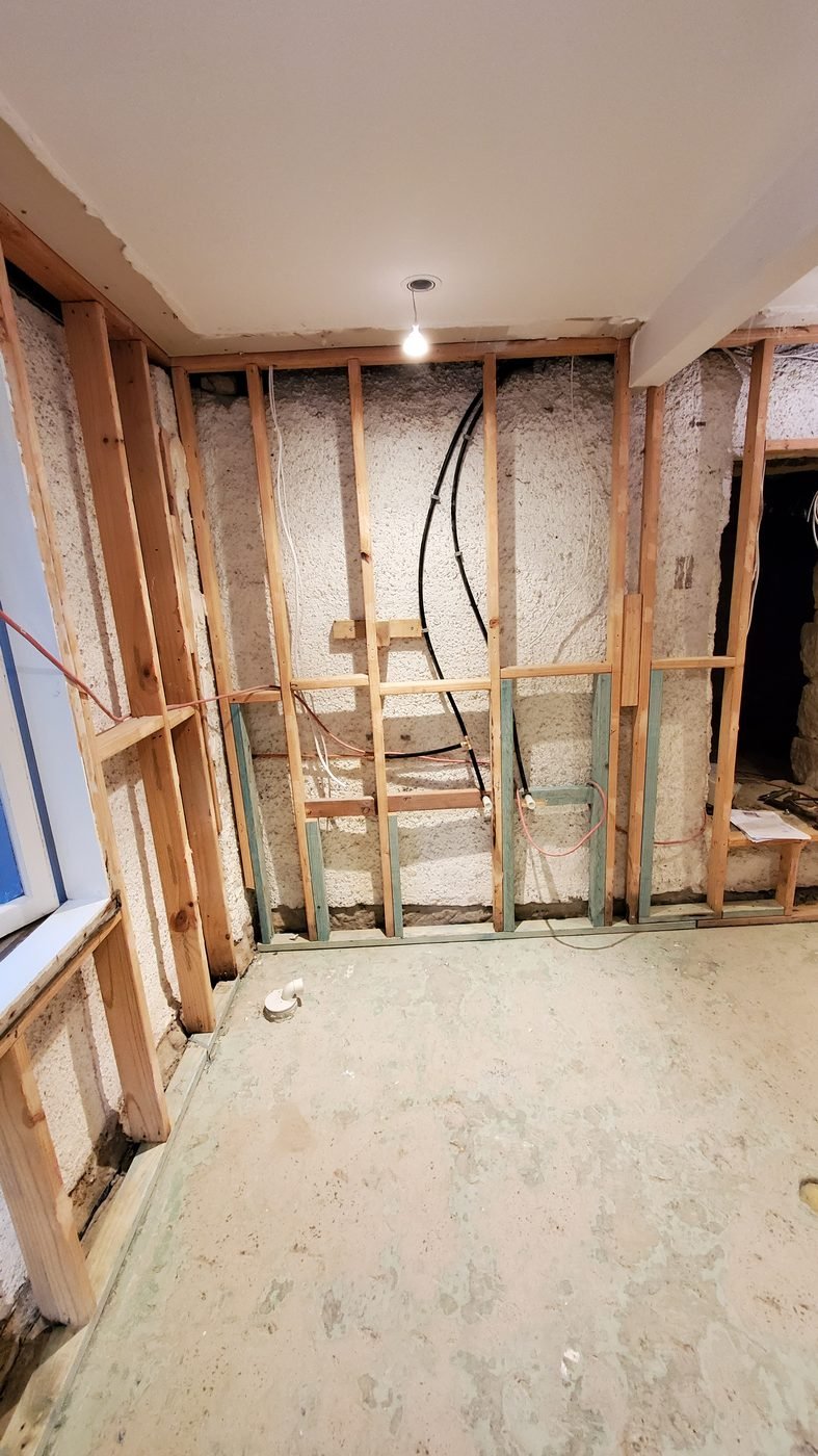 Before: bathroom stripped back to the wall frame