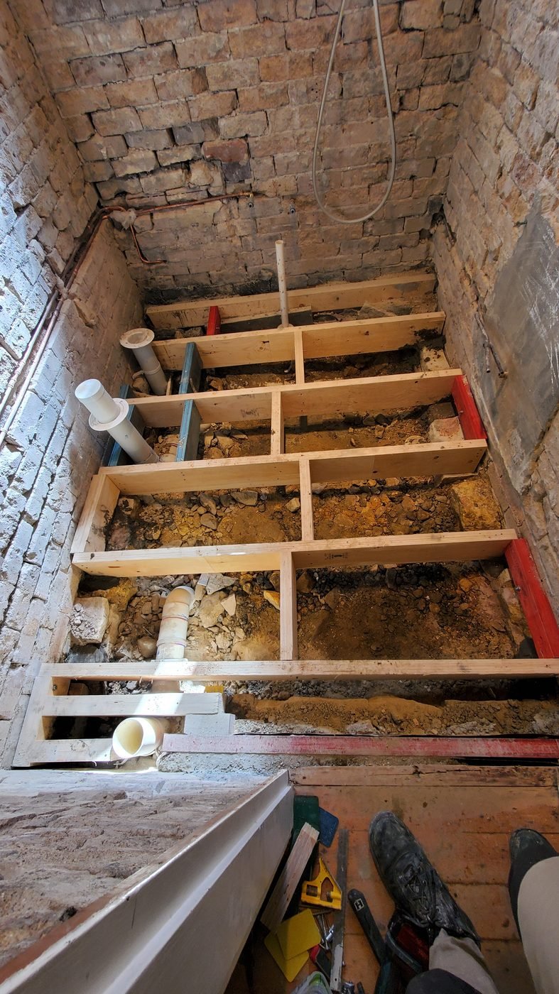 Step 3: new timber floor framing in the stripped-back bathroom