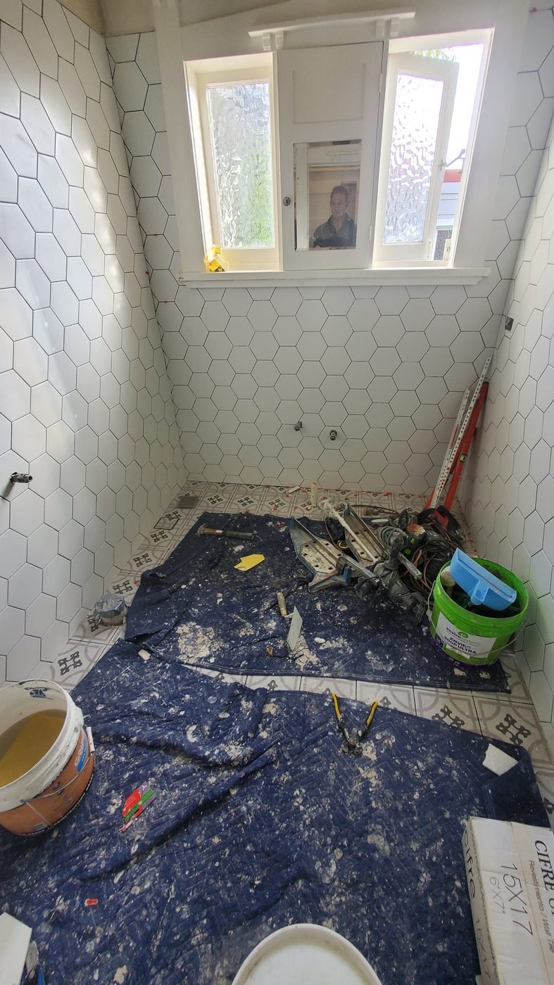 Step 5: hexagon wall tiles and patterned floor tiles going in