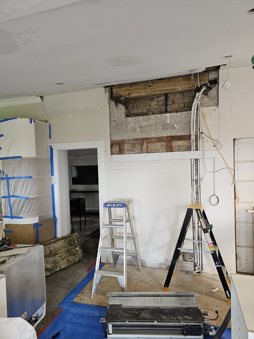 Before: wall opened up during the renovation