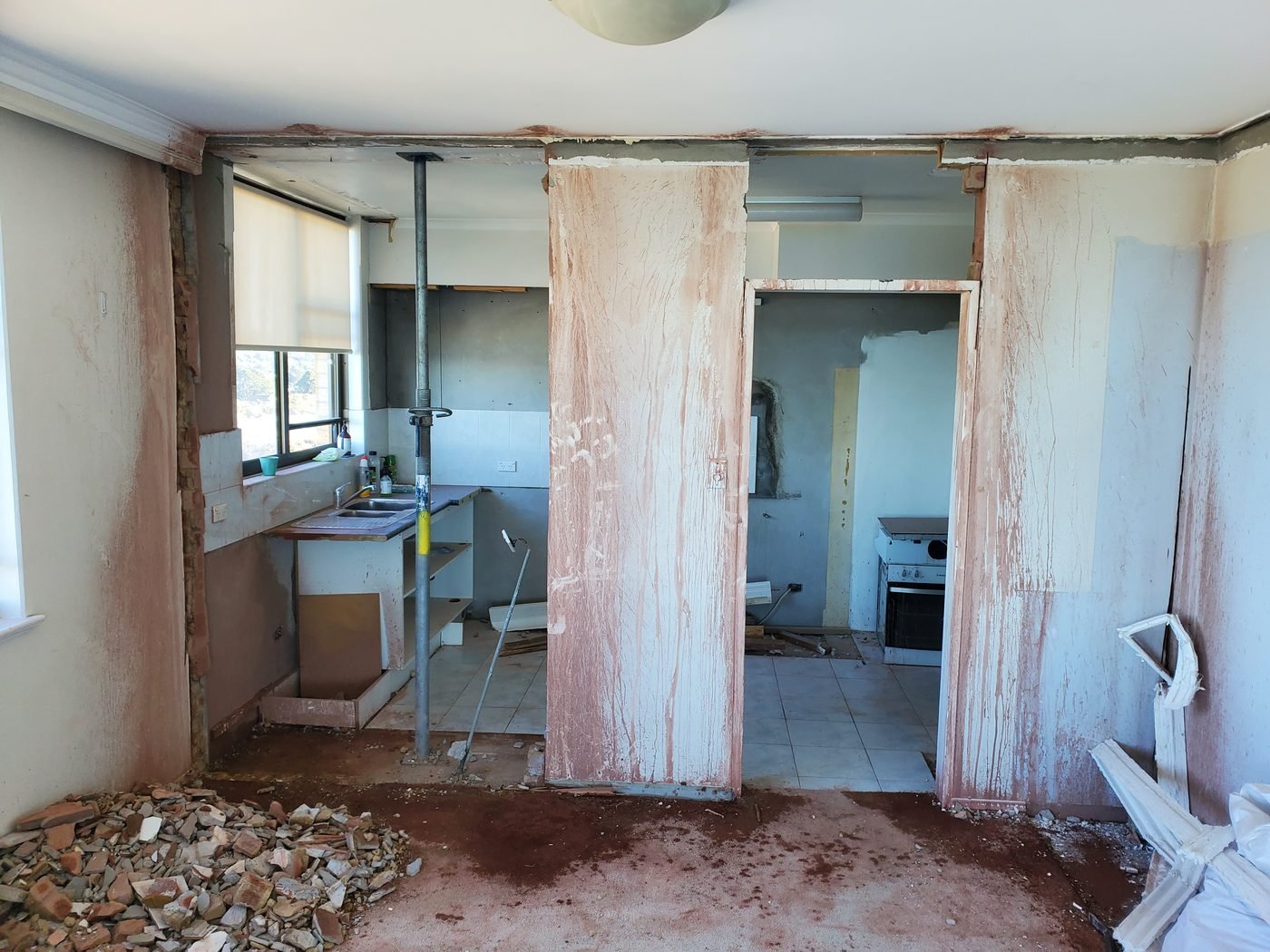 Before: kitchen and living area gutted during renovation
