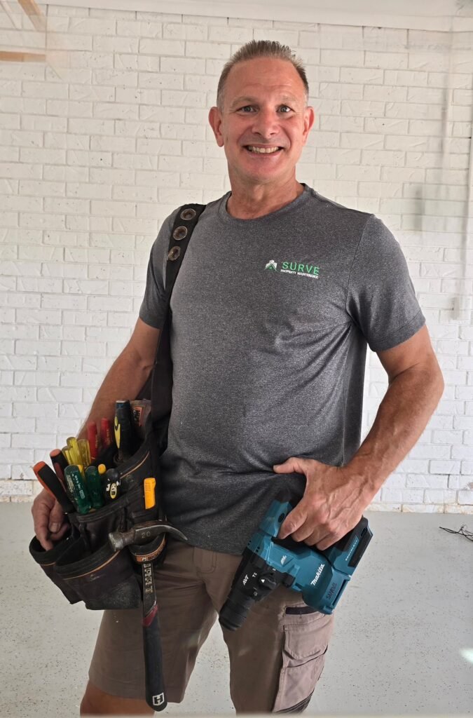 SURVE handyman wearing a tool belt